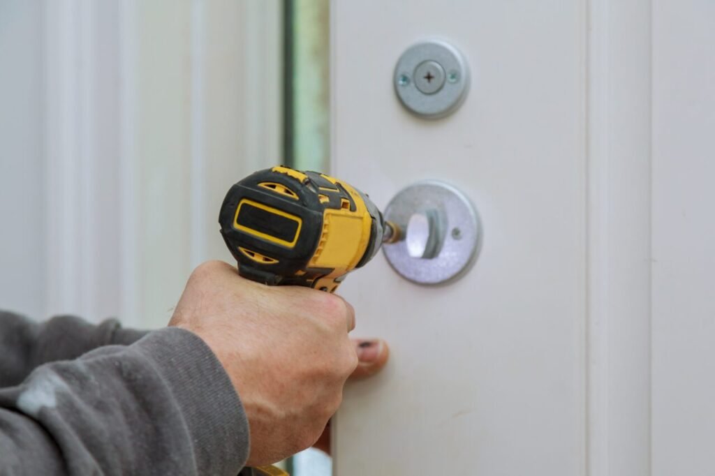 carpenter installation at interior wood door lock e1696321465701